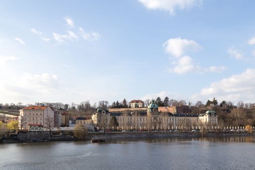 Prague, Czech Republic - March 15, 2017: View over Vltava River with Straka Academy, the seat of the government