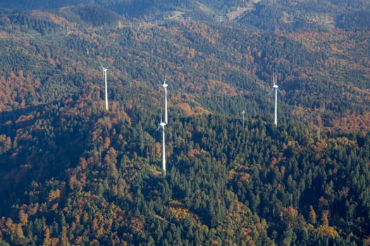 Aerial view of several wind power plants on a hill in the Black Forest in Southern Germany