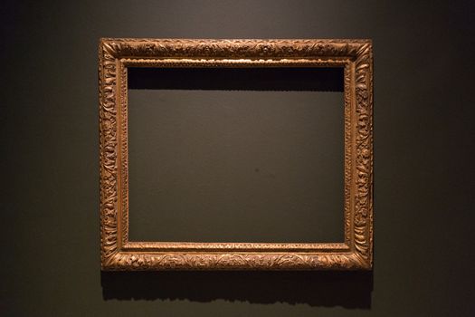 An empty painting frame in a museum