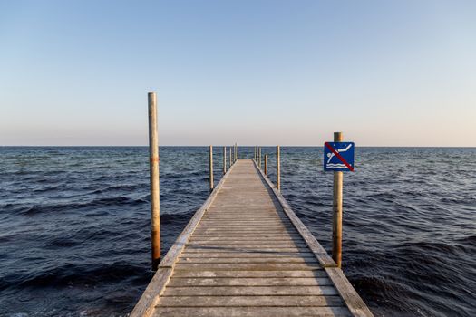 Ishoj, Denmark - September 24, 2017: A wooden pier at the beach in Ishoj just South of Copenhagen.