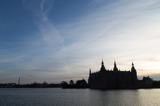 Silhouette photo of Frederiksborg Castle in Hillerod, Denmark.