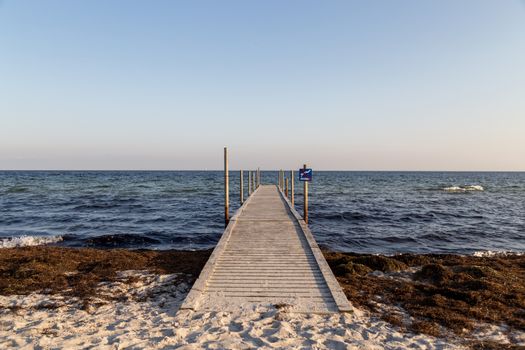 Ishoj, Denmark - September 24, 2017: A wooden pier at the beach in Ishoj just South of Copenhagen.