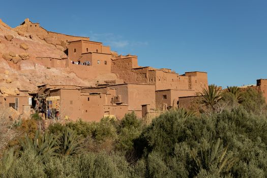 Ait Ben Haddou ksar Morocco, ancient fortress that is a Unesco Heritage site. Beautiful late afternoon light with honey, gold coloured mud brick construction the kasbah, or fortified town dates from 11th cent. and is on the former caravan route from the Sahara and Marrakech. The location has been used for many famous movies. High quality photo