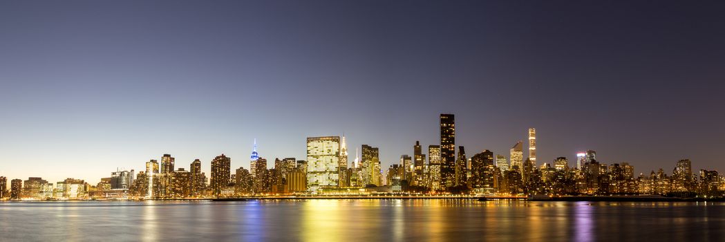Panoramic view of the skyline of midtown Manhattan in New York by night