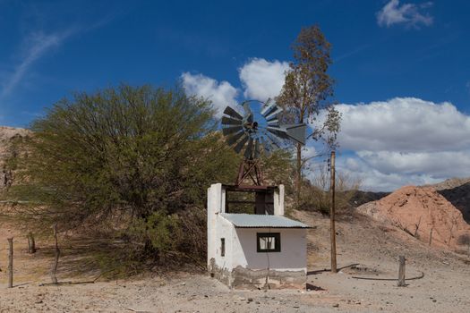 Photograph of a small windmill on route 40 in Northwest Argentina.