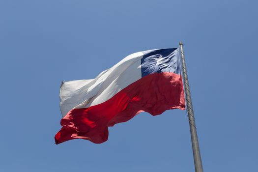 Photograph of the Chilean Flag blowing in the wind.
