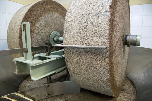 A grinding stone inside an olive oil factory in Mendoza, Argentina