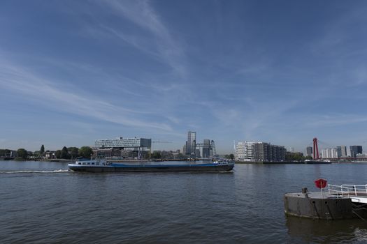 cityscape of Rotterdam with De Hef on the left and the Erasmus bridge on the right