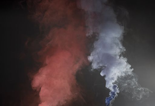 Violet and blue smoke texture on a black background. Texture and abstract art