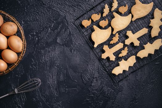 Design concept of making Halloween cookies, baking recipe ingredients layout of preparing party, top view, flat lay, overhead, blank copy space.