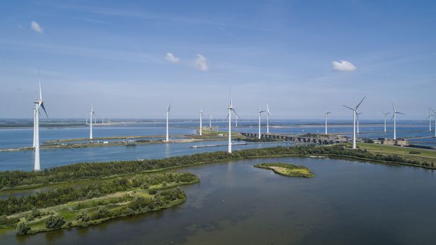 Wind turbine from aerial view, Drone view at windpark krammersluizen a windmill farm in the lake grevelingen in the Netherlands,Sustainable development, renewable energy