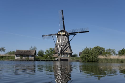 Netherlands rural lanscape with windmills at famous tourist site Kinderdijk in Holland. Unesco site.