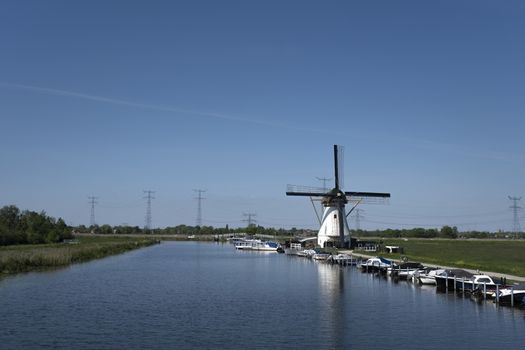 Netherlands rural lanscape with windmills at famous tourist site Kinderdijk in Holland. Unesco site.