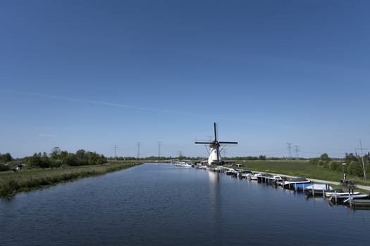 Netherlands rural lanscape with windmills at famous tourist site Kinderdijk in Holland. Unesco site.