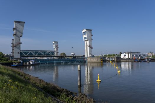 the Algera flood barrier in the river Hollandse IJssel in the background on a sunny day in summertime