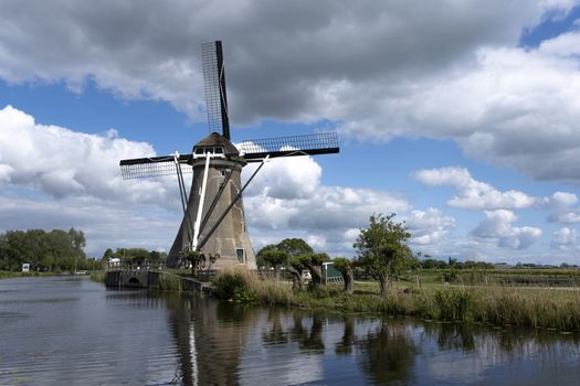 Traditional setting of the historical dutch windmills landscape at the Netherlands, an UNESCO world heritage site in holland