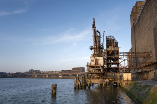 old fashion rusty Port grain elevator. Industrial sea trading port bulk cargo zone in Rotterdam harbour