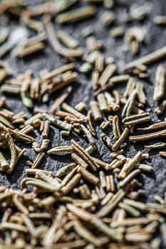 Rosemary closeup on luxury stone background as flat lay, dry food spices and recipe ingredients