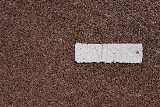 Tarmac texture. Markings painted on a tarmac road. Top view