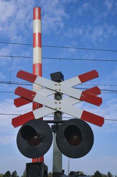 Road signs at the railway crossing with a barrier. Organization of the transport system of a European country. Safety of traffic in road and rail transport, Rotterdam Netherlands