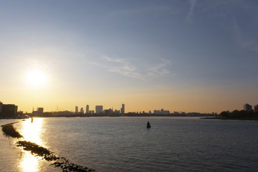 Rotterdam Skyline with Erasmusbrug bridge at sunset in morning in Rotterdam, Netherlands