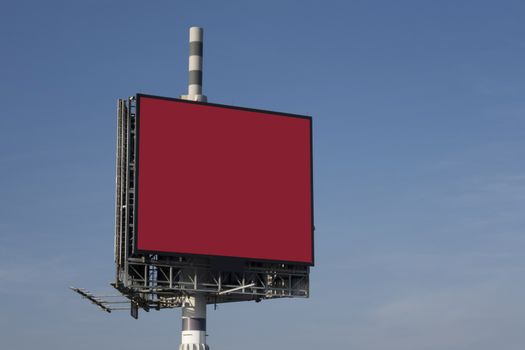 Billboard against clouds and blue sky background. Copy space banner for advertisement. Business Concept.