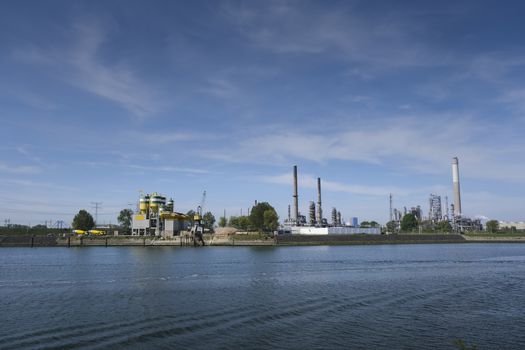 Refinery tower in petrochemical industrial plant with cloudy sky, Refinery factory oil storage tank and pipeline steel