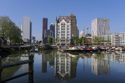 Oudehaven Harbor with historical houseboats with the White House. Witte Huis and Willemsbrug Bridge in the background - Rotterdam, Netherlands