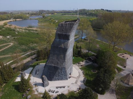 An outdoor rock climbing structure at a playground at a park