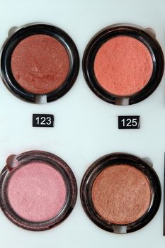 Frame with various makeup products mix, macro