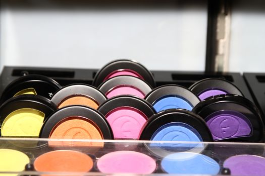 Frame with various makeup products mix, macro