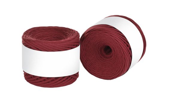 Two skeins of vinous color elastic knitted cotton yarn for crochet. Roll with mockup label layout on white background. Use for handwork, creating wicker baskets and home accessories.