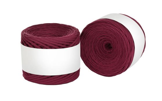 Two skeins of vinous color elastic knitted cotton yarn for crochet. Roll with mockup label layout on white background. Use for handwork, creating wicker baskets and home accessories.