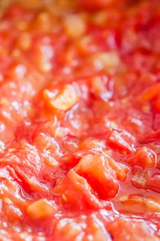 Cooking tomato sauce, closeup steamed vegetables for cook book or food blog backgrounds