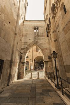 MODENA, ITALY 1 OCTOBER 2020: Arcades in the alley adjacent to the Modena Cathedral in Italy