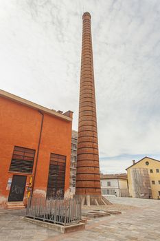 MODENA, ITALY 1 OCTOBER 2020: Detail of a Old Industrial building with chimney in Italy