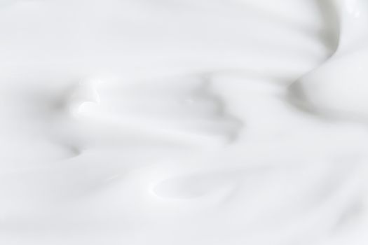 Pure white cream texture as abstract background, food substance or organic cosmetics