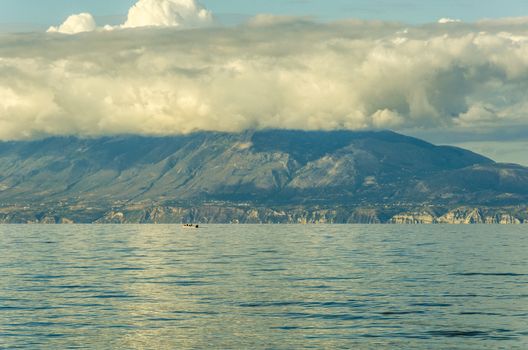 boat in the Ionian sea in front of the cliffs of the coasts of the island of zakynthos