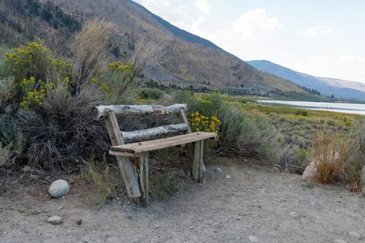 Small wood bench to observe the view at Mono Lake, Mono County, California, USA