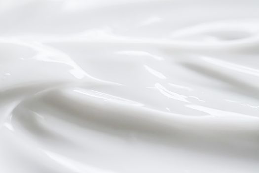 Pure white cream texture as abstract background, food substance or organic cosmetics