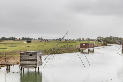 Carrelet de Pêche, the emblematic fisherman's hut of the coastal landscapes of Vendee, Charente-Maritime, in the estuary of La Gironde, La Charente, La Loire or in the Marais Poitevin