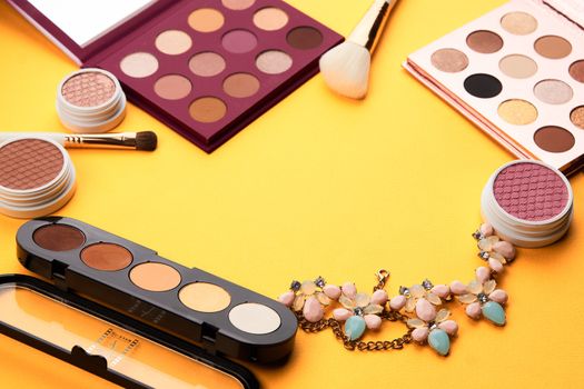 Professional cosmetics palette with eyeshadow makeup brushes cropped look. High quality photo