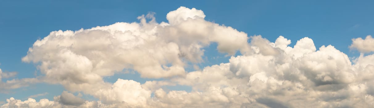 Panoramic white fluffy clouds in the blue sky, Fantastic soft white clouds against blue sky