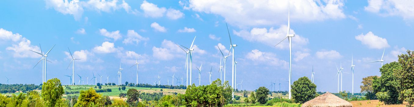 Panorama Wind turbine  generators line the hilltops and Aerial landscape with blue sky