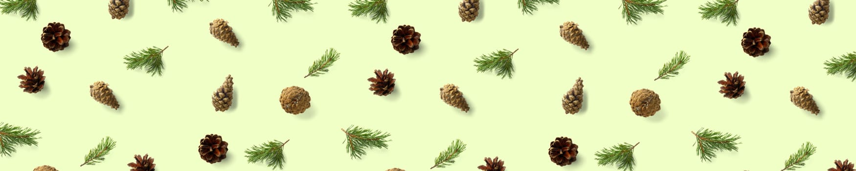 Creative Pine cone Christmas background on green. Pine branches and cones. minimal creative cone arrangement pattern. flat lay, top view. new year background wallpaper. Nature pinecone modern christmas Background