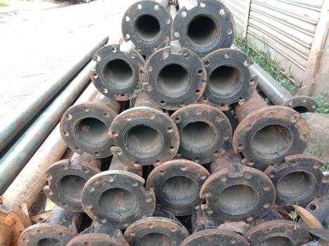 old Iron pipe stock near of river for sand collection