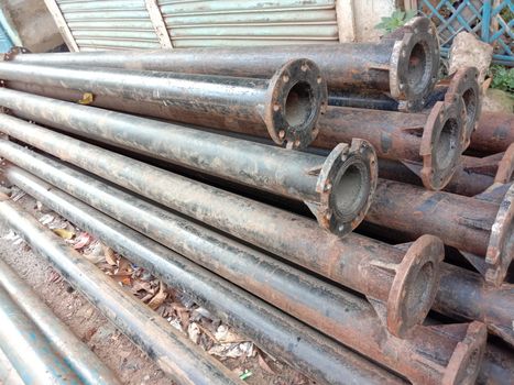 old Iron pipe stock near of river for sand collection