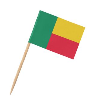 Small paper flag of Benin on wooden stick, isolated on white