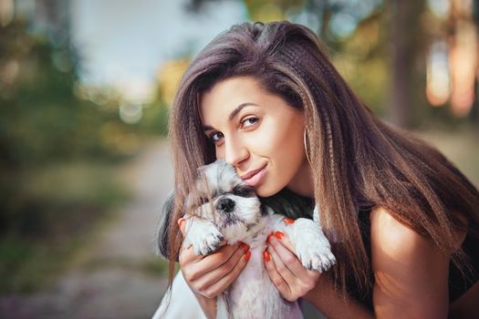 Oung woman with her cute Shih Tzu. Lovely pet