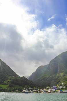 Sunshine and rain at same time in Undredal village Aurlandsfjord Aurland Vestland Sognefjord in Norway.